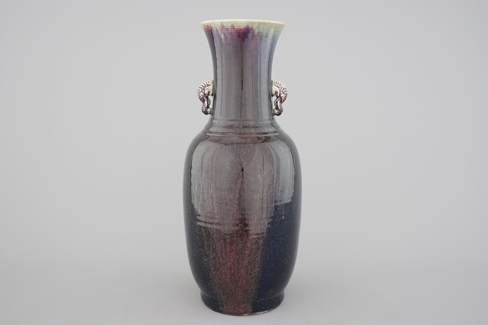 A tall Chinese porcelain flambe glaze vase with elephant handles, 19/20th C.