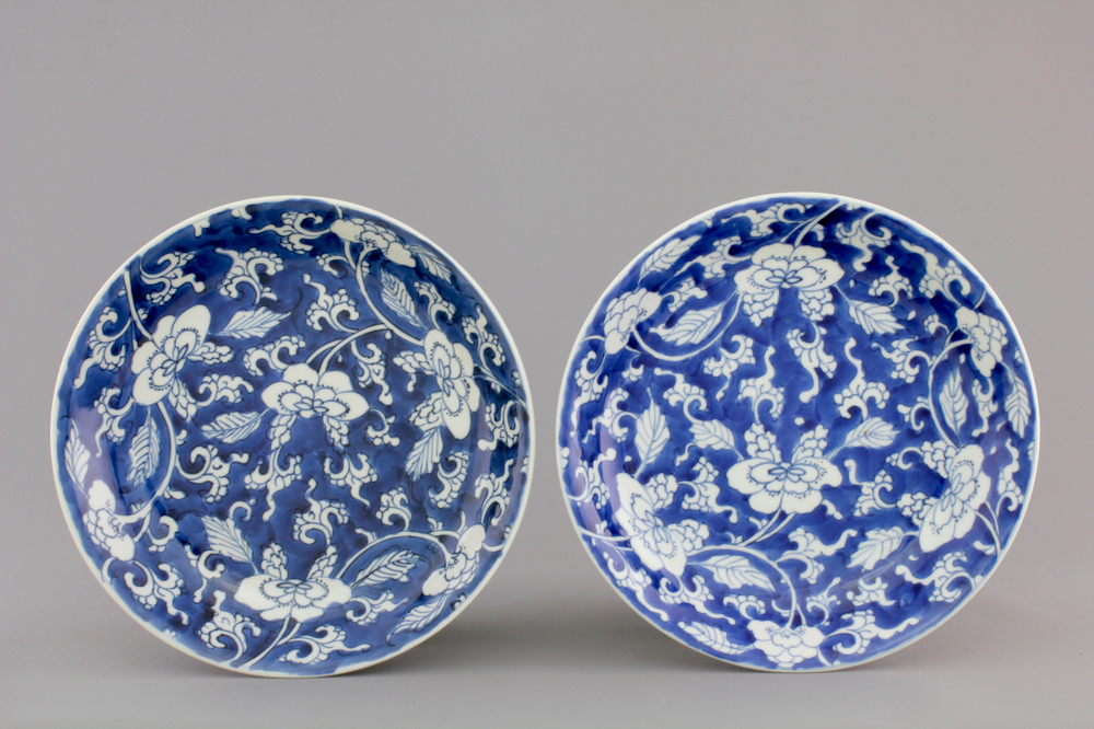 A nice pair of Chinese blue gound plates with peony scrolls, Kangxi, ca. 1700
