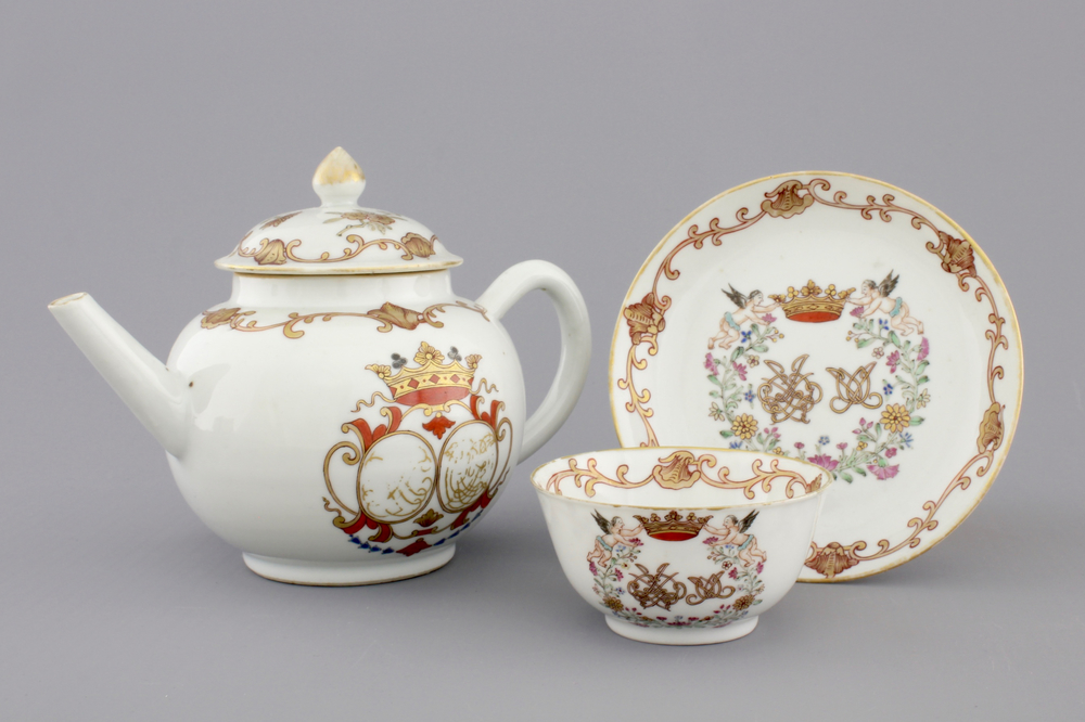 A Chinese porcelain famille rose and gilt armorial monogrammed teapot with a cup and saucer, 18th C.