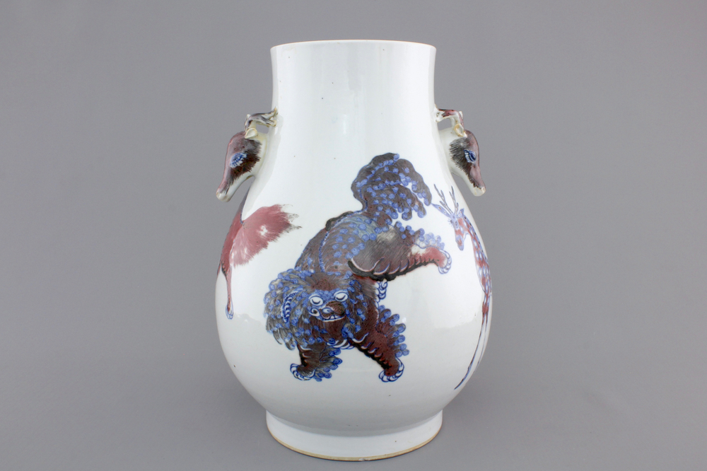A Chinese hu-shaped deer-handled underglaze red and blue vase with finely painted animals, ca 1900