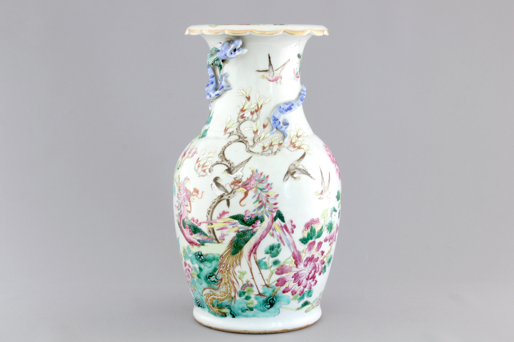 A Chinese porcelain famille rose vase with dragons, 19th C.