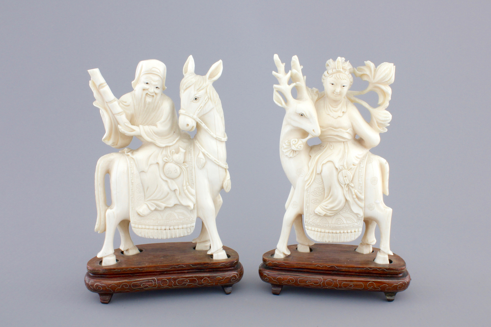 Two carved ivory figures of Chinese immortals on deers, ca. 1920