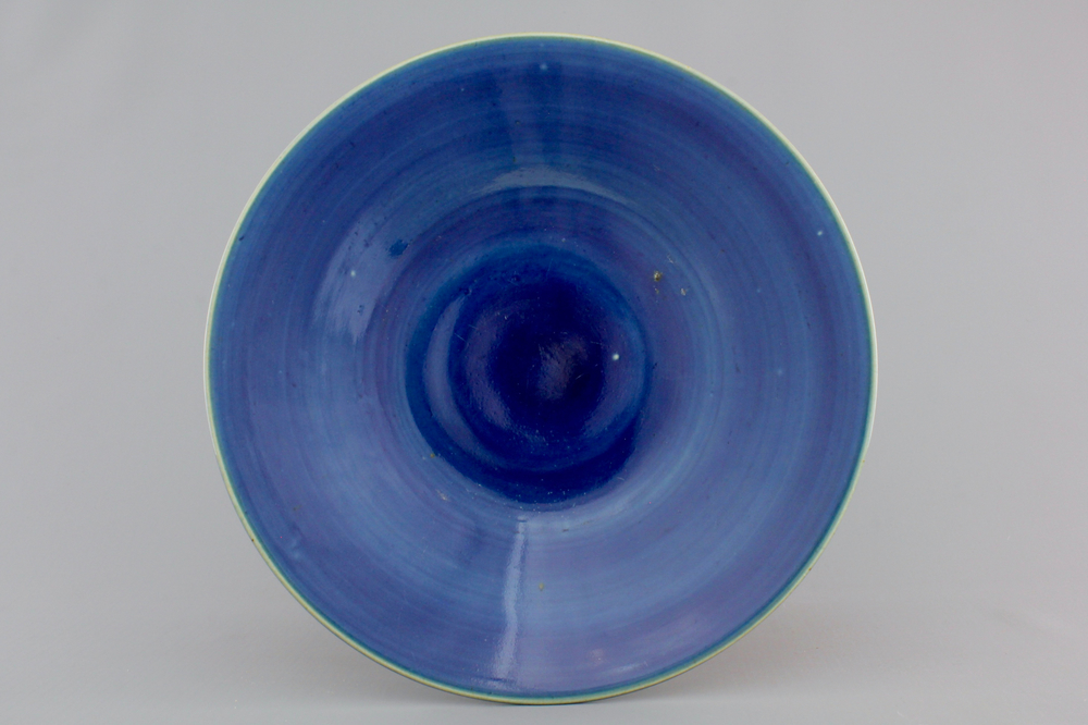 A Chinese porcelain blue monochrome plate, 19th C.