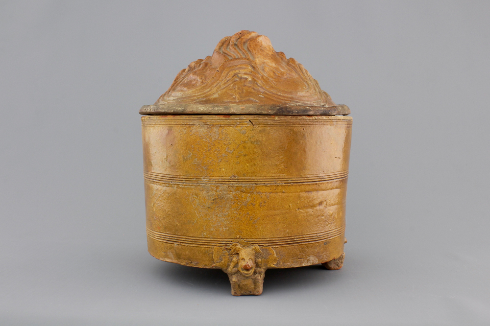 A brown-glazed pottery tripod vessel and mountain cover, Han Dynasty (206 BC-220 AC)