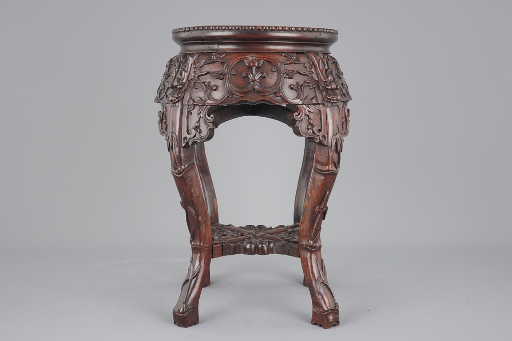A finely carved Chinese hardwood marble top vase stand, 19th C.
