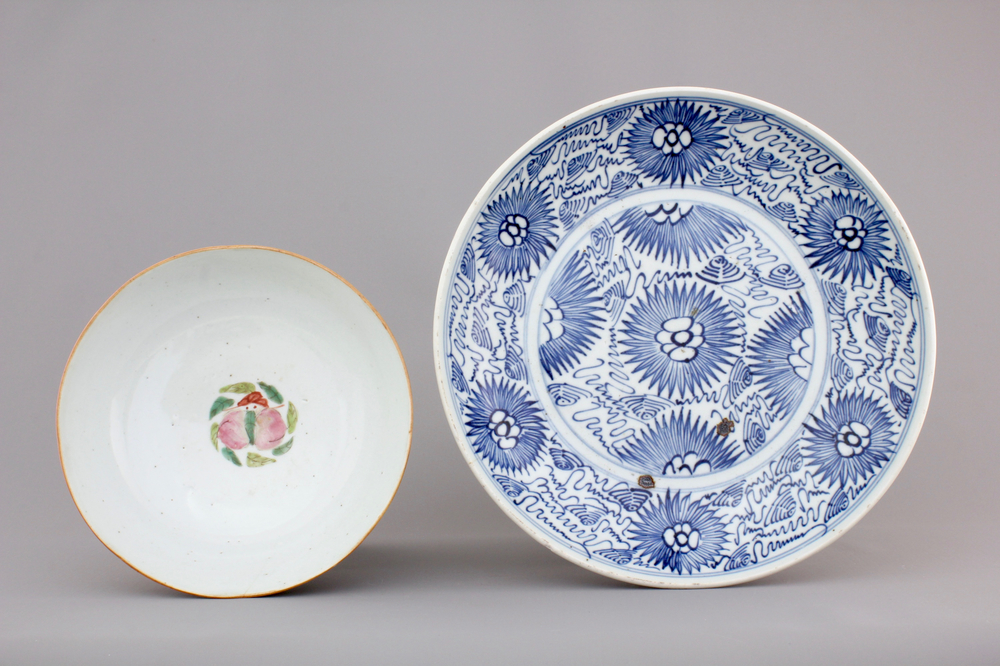 A blue and white Chinese porcelain plate with flowers and a famille rose bowl, 18th C.
