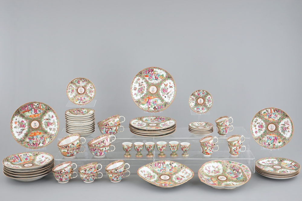 A 62-piece Chinese Canton rose medallion armorial 6-person service of big and small plates, cups and saucers, egg cups and serving trays, 19t C.