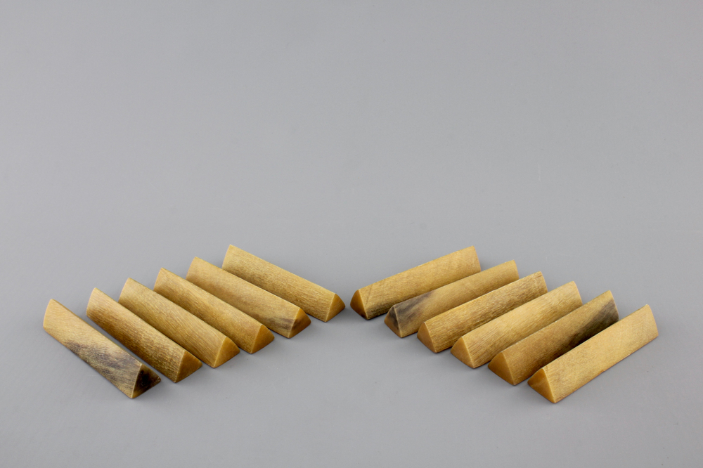 A set of 12 rare polished rhinoceros horn knife rests, ca. 1900