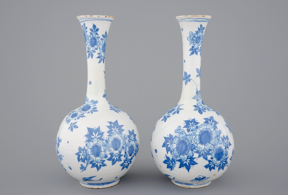 A pair of Dutch Delft blue and white bottle-shaped vases, 17th C.