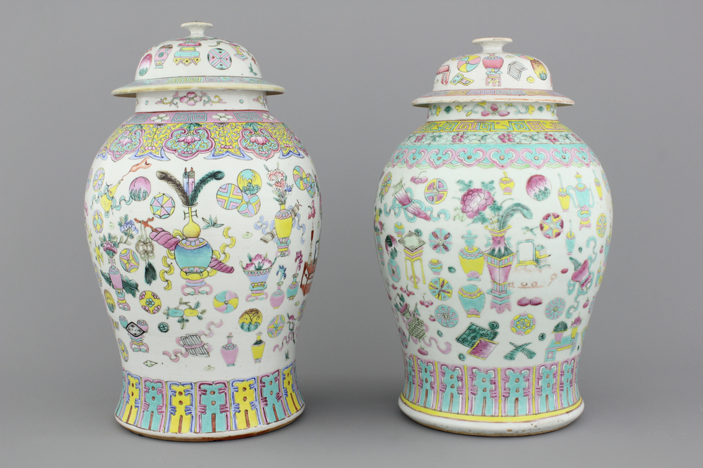 Two Chinese porcelain famille rose jars and covers with scholar's objects, 19th C.