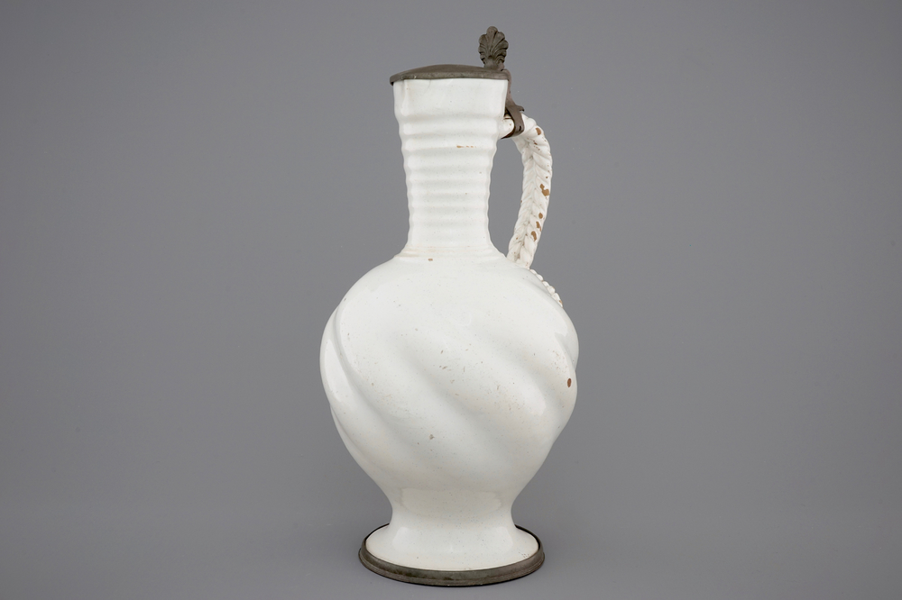 A large white Delft pewter-mounted jug with rope twist handle, 17th C.
