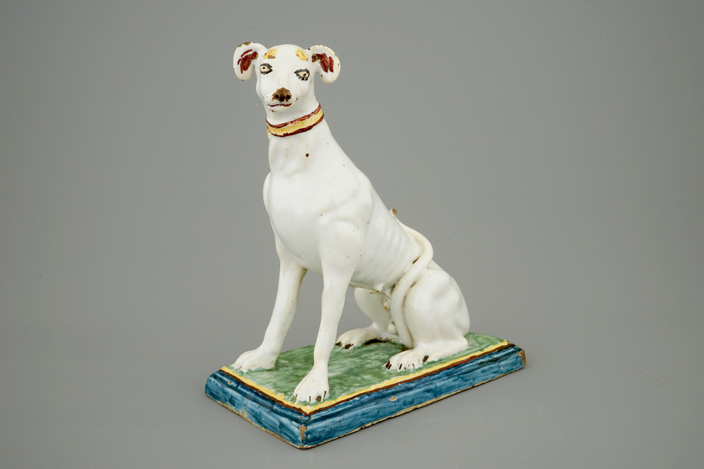 A tall polychrome Brussels faience model of a sighthound, 18th C.