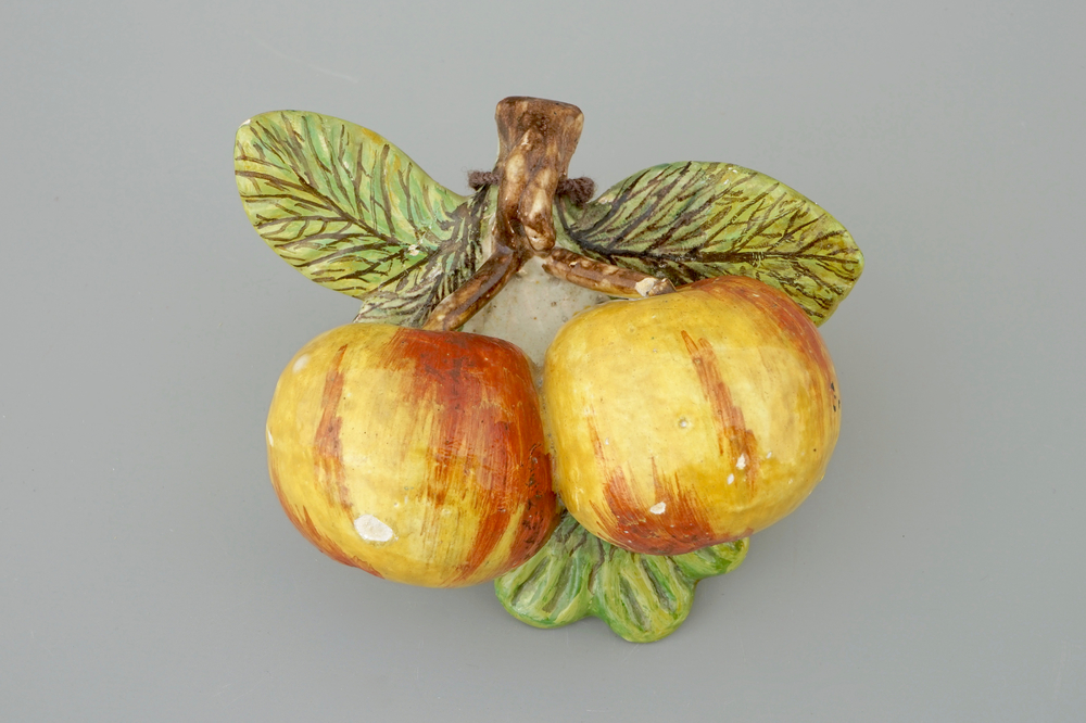 A pair of hanging apples in Dutch Delftware, 18th C.