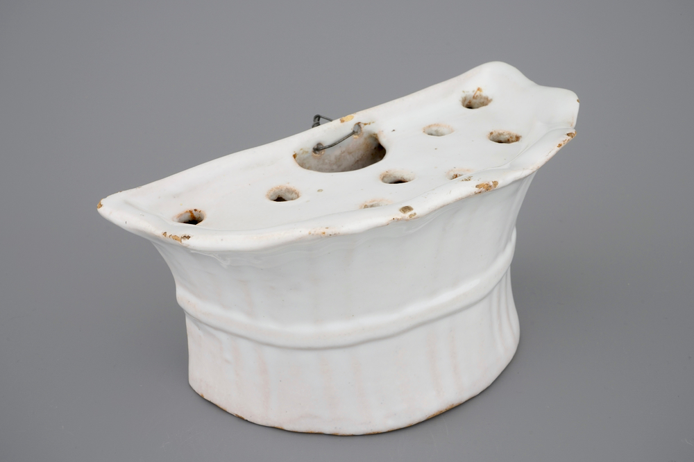 A white Delft pottery wall flower holder, 18th C.