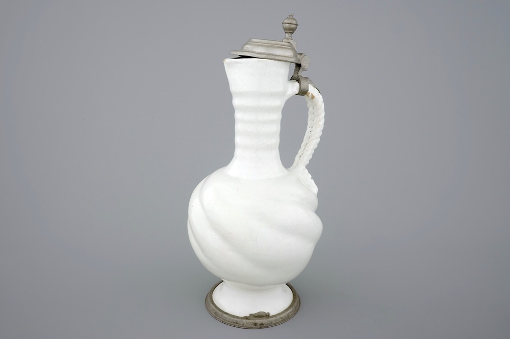 A large white Delft pewter-mounted jug with rope twist handle, 17th C.