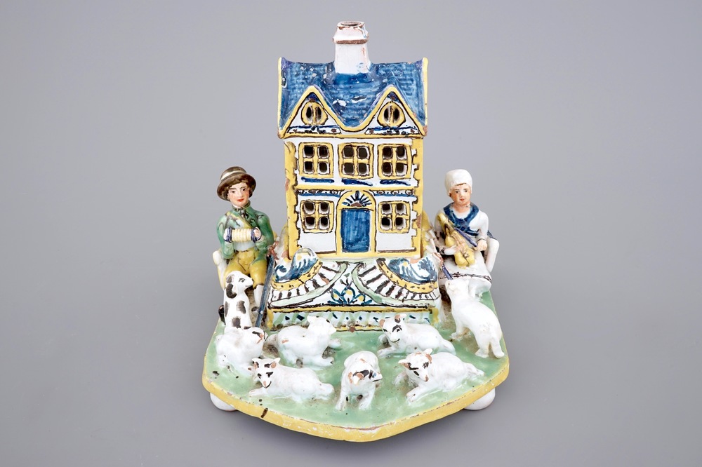 A rare French pottery group with musicians herding sheep by a house, 18th C.