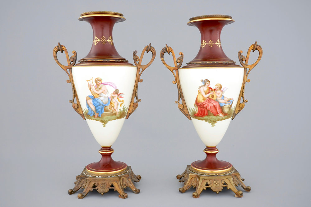 A pair of S&egrave;vres style vases with bronze mounts, Brussels, 19th C.