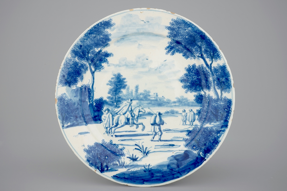 A fine Dutch Delft blue and white plate with a pastoral scene, 18th C.