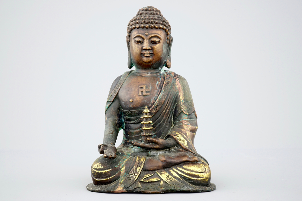 A Sino-Tibetan gilt bronze figure of a seated Buddha, 19th C.