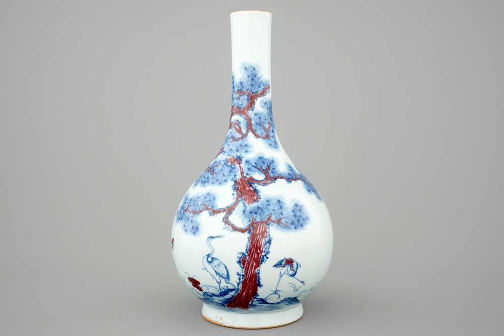 A Chinese blue and underglaze red bottle vase with cranes, 19/20th C.
