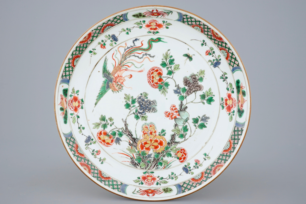 A fine Chinese famille verte dish with a flying fenghuang, Kangxi