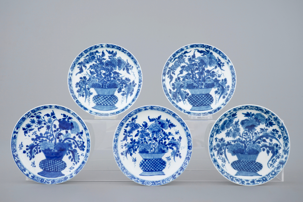 A set of five Chinese blue and white plates with flower baskets, Kangxi