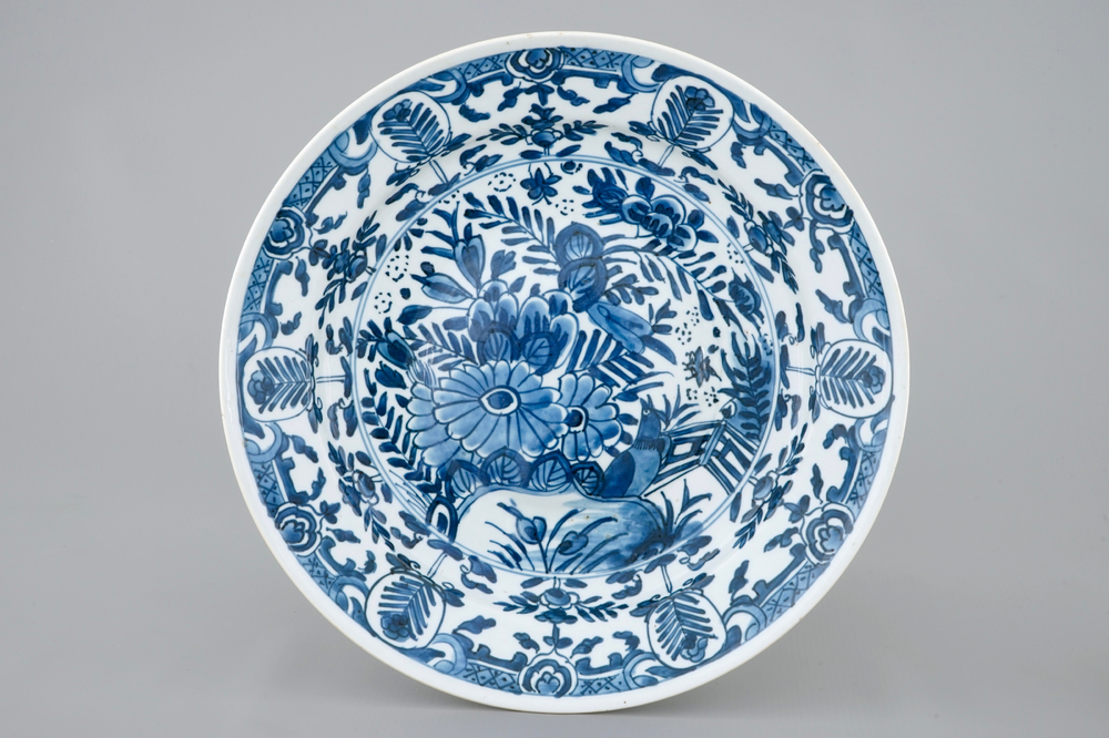 A rare Chinese blue and white plate after a Dutch Delft example, Qianlong, 18th C.