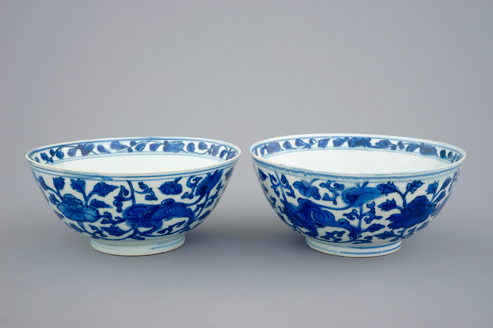 A pair of Chinese blue and white bowls with lions among peony scrolls, late Ming Dynasty