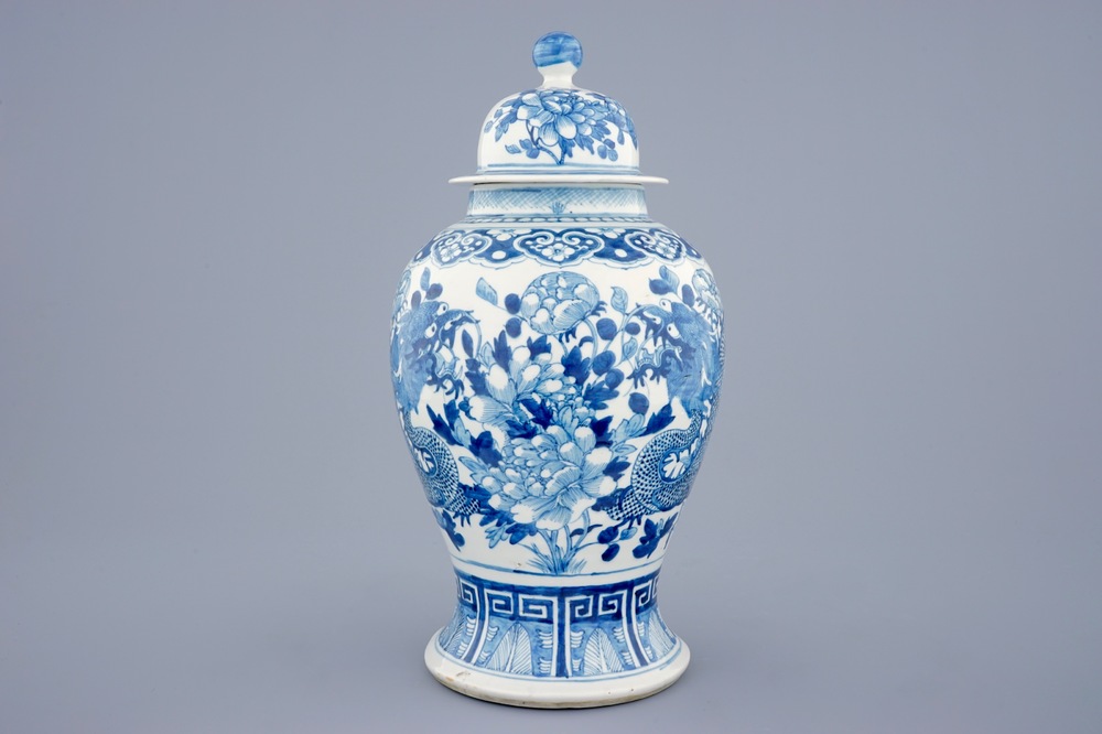 A Chinese blue and white vase and cover with dragons and peonies, 19th C.