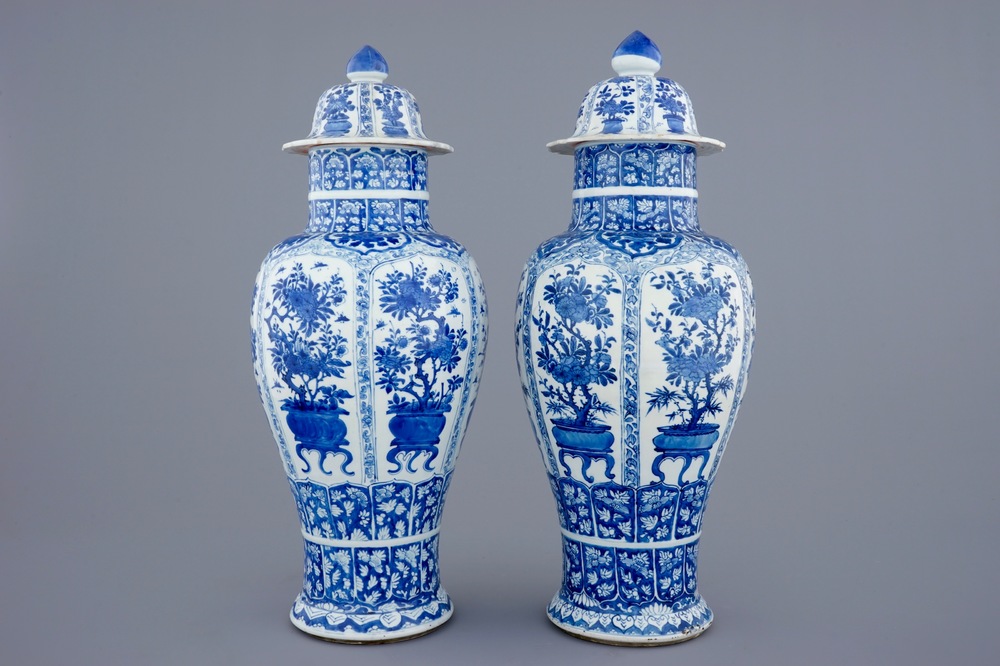 A pair of large Chinese blue and white vases and covers, Kangxi