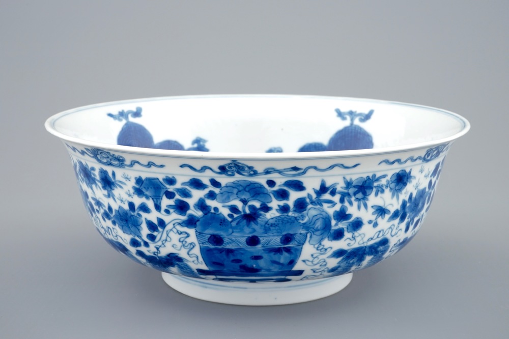A Chinese blue and white dragon bowl with floral design, Kangxi