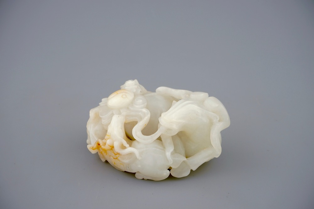 A Chinese white jade carving of a "Three rams" group, 19/20th C.
