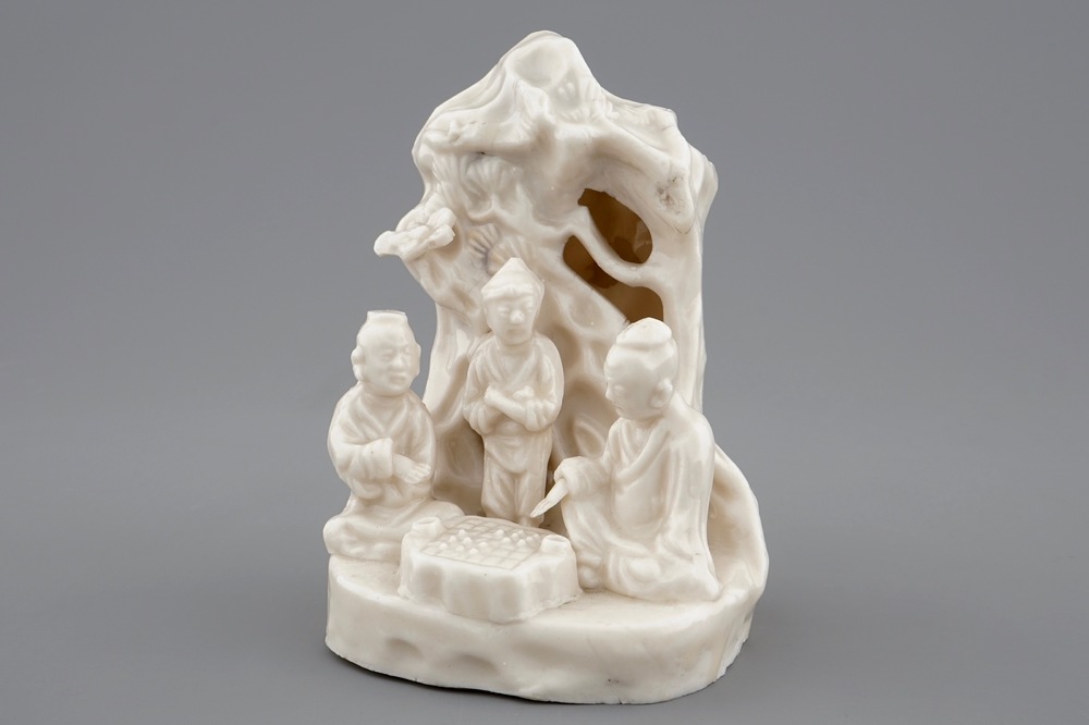 A Chinese blanc de Chine Dehua group of go-players beneath a pine tree, Kangxi
