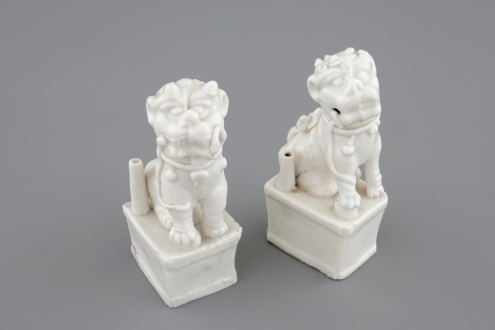 A pair of Chinese Dehua blanc de Chine buddhist lion joss stick holders, 18/19th C.