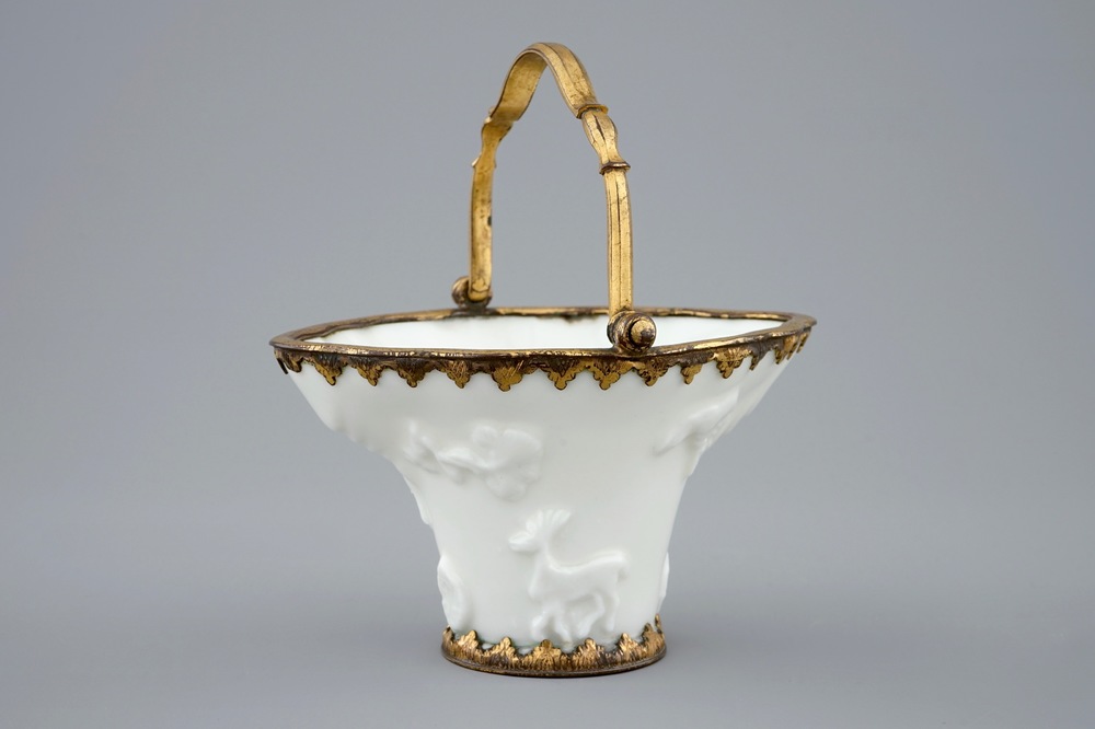 A Chinese blanc de Chine libation cup with gilt bronze mounts, Kangxi