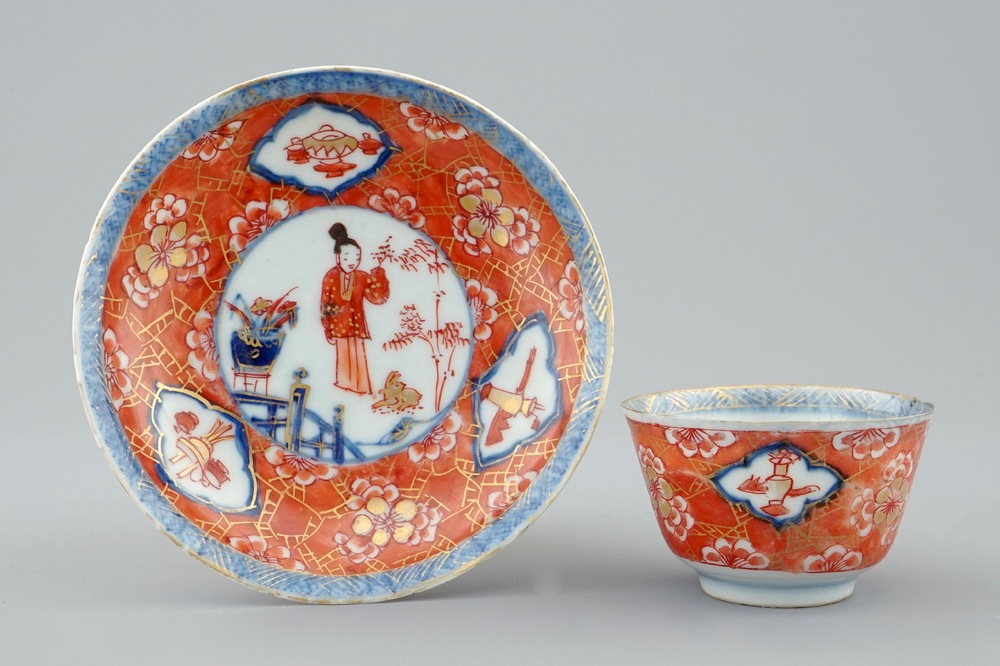 A Chinese blue and white on coral ground cup and saucer, Kangxi