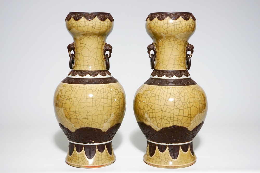 A pair of Chinese crackle glazed caf&eacute; au lait ground Nanking vases, 19th C.