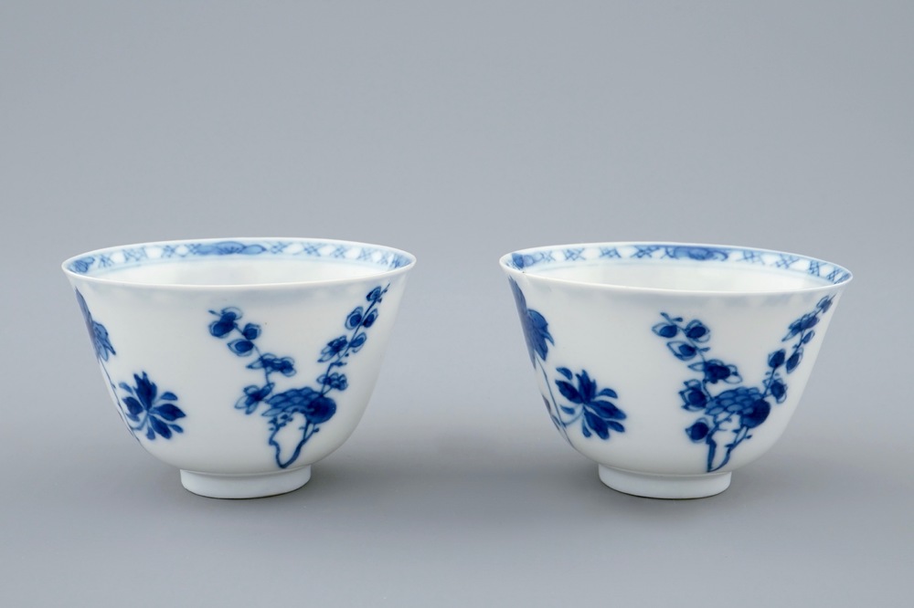 A pair of Chinese blue and white wine cups with 4 floral patterns, six-character mark, Kangxi