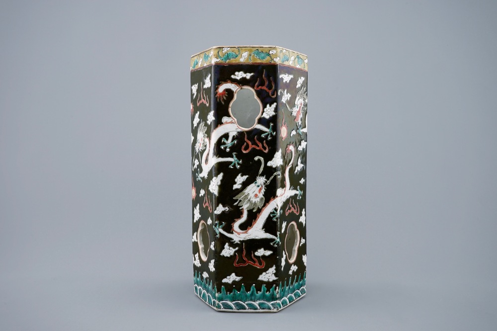 A Chinese black ground open worked hat stand with dragons, 19th C.