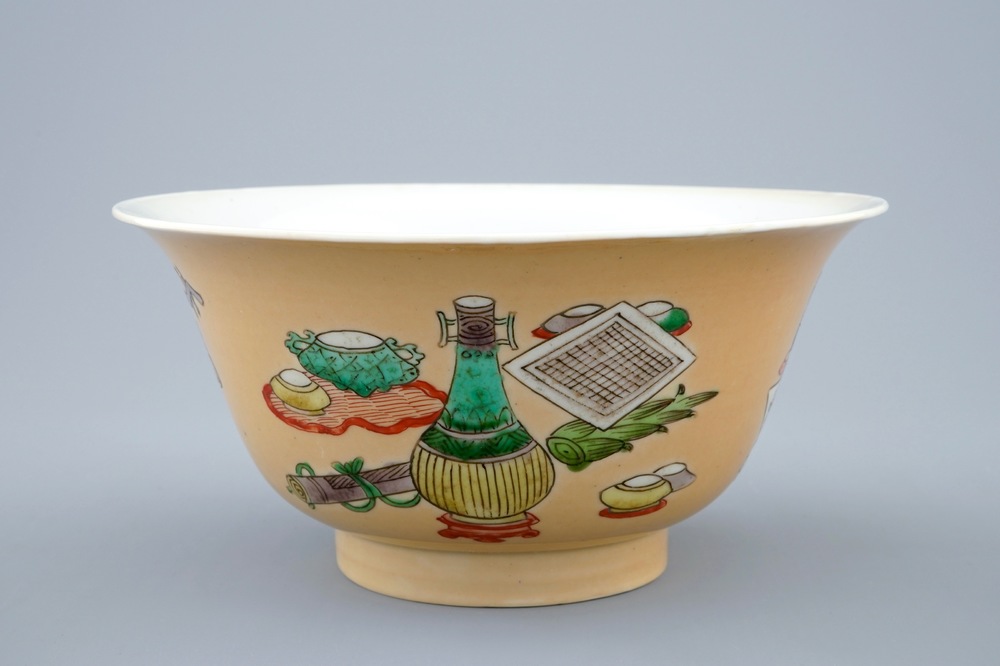 A Chinese famille verte caf&eacute; au lait ground bowl with precious objects, Kangxi