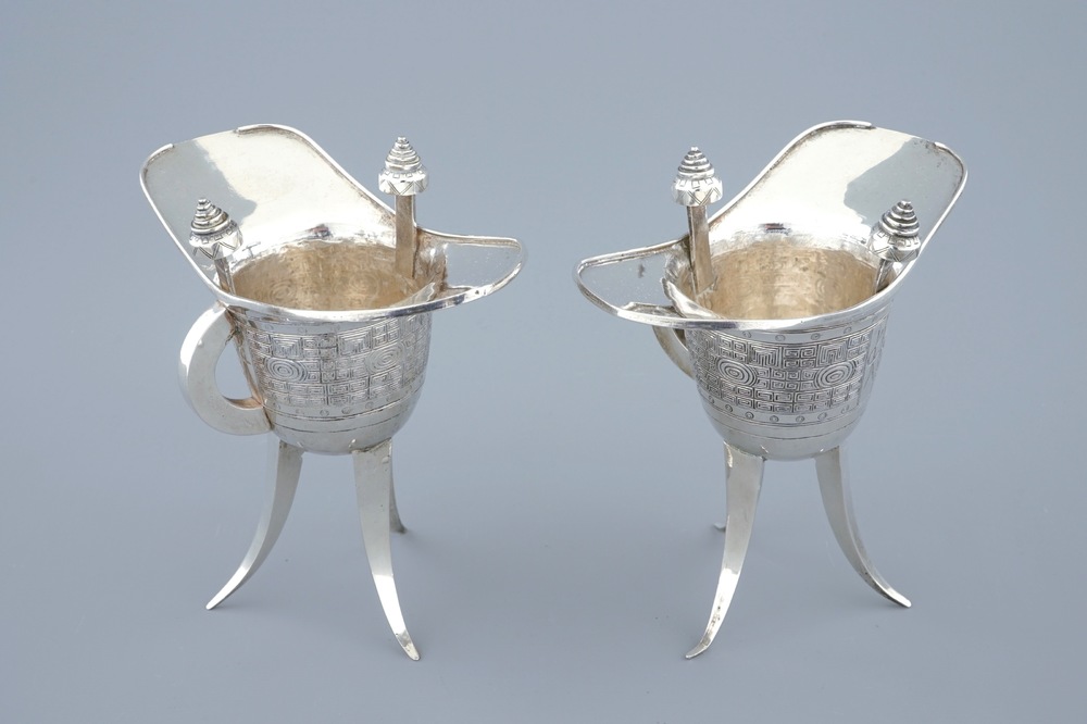 A pair of Chinese silver archaic "Jue" wine cups marked for Heng Li, Tientsin, 19th C.