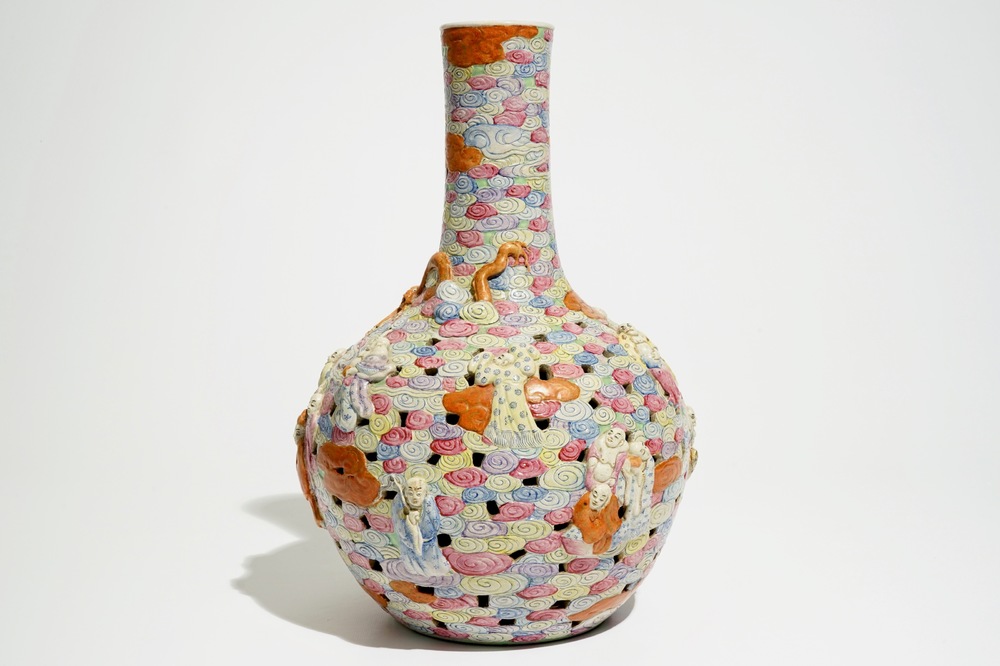 A Chinese famille rose reticulated bottle vase with figures, 19th C.