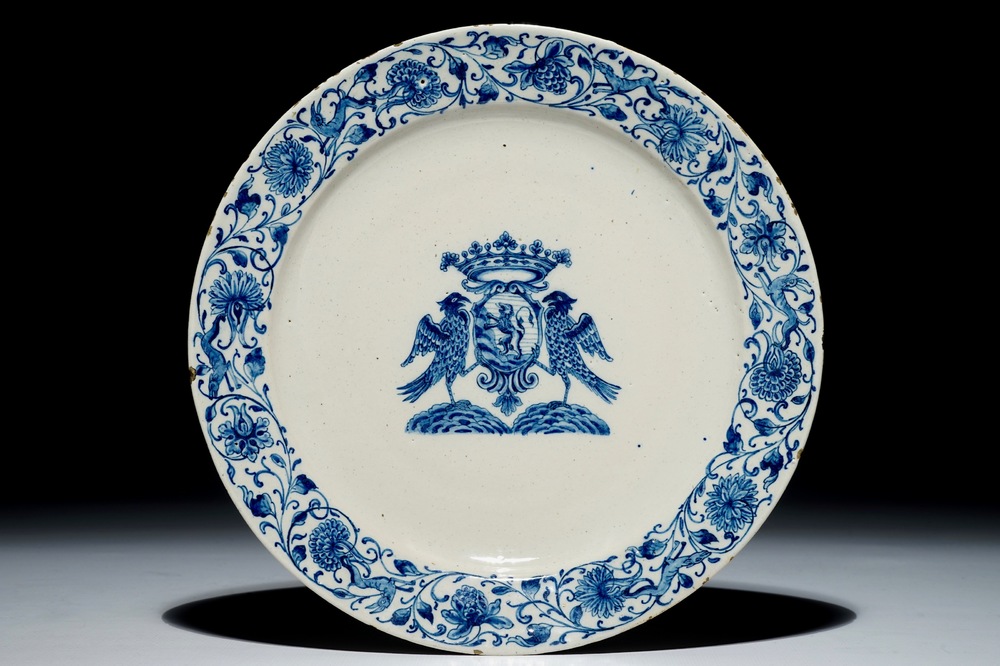 A Dutch Delft blue and white armorial plate, 17th C.