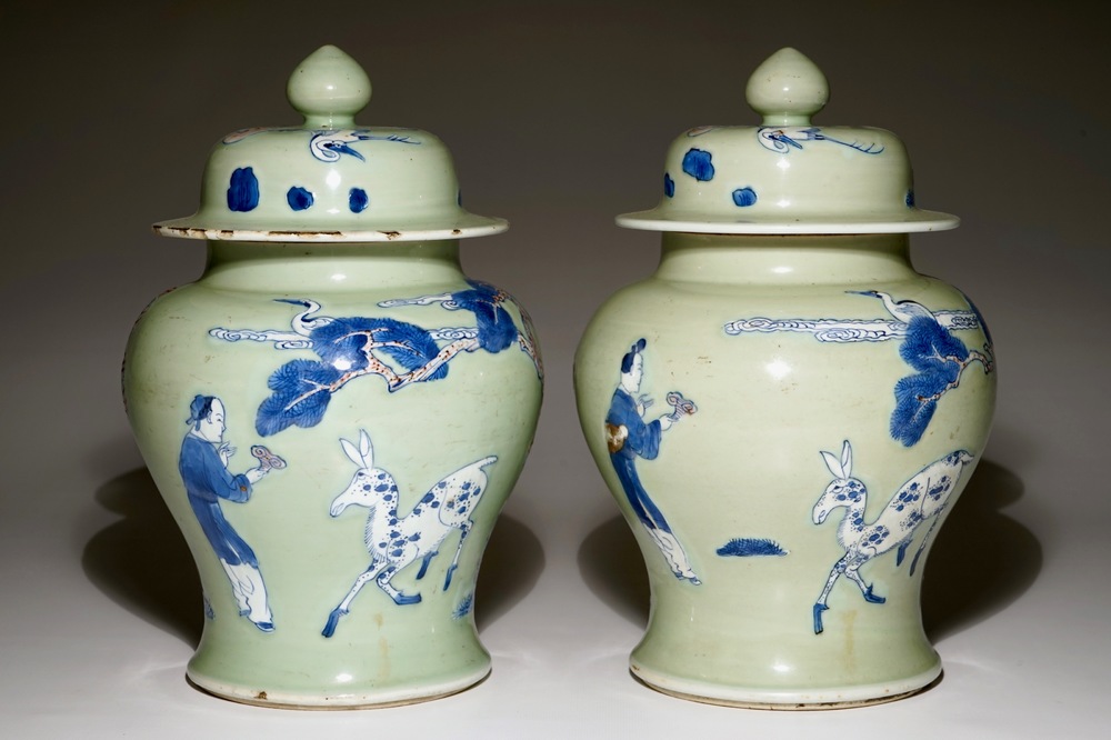 A pair of Chinese celadon, copper-red and underglaze blue vases and covers, Kangxi