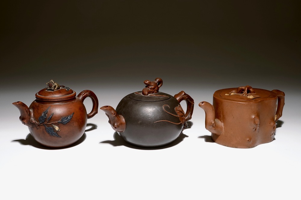 A set of three Chinese Yixing teapots, 20th C.
