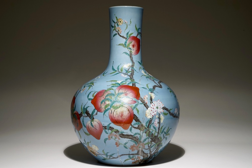 A Chinese famille rose blue ground tianqiuping &ldquo;Nine peaches&rdquo; vase, 19/20th C.