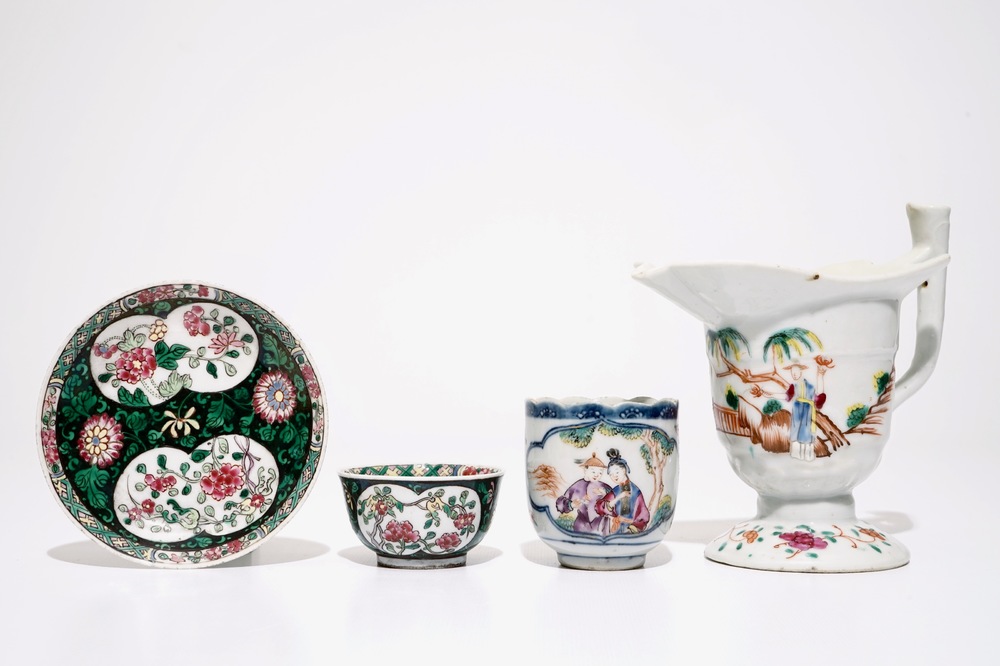 A Chinese famille rose jug, a cup and saucer and another cup with ear, 18th C.