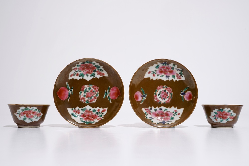 A pair of Chinese famille rose capucin ground cups and saucers, Qianlong