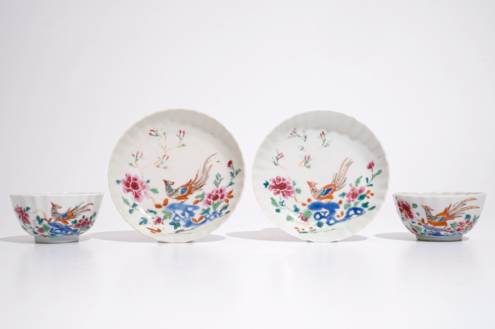 A pair of Chinese famille rose cups and saucers with peacocks, Qianlong