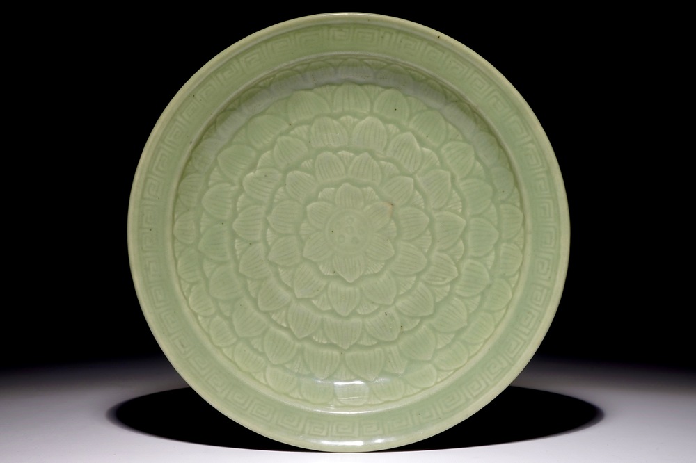 A Chinese celadon dish with incised lotus design, 19th C.